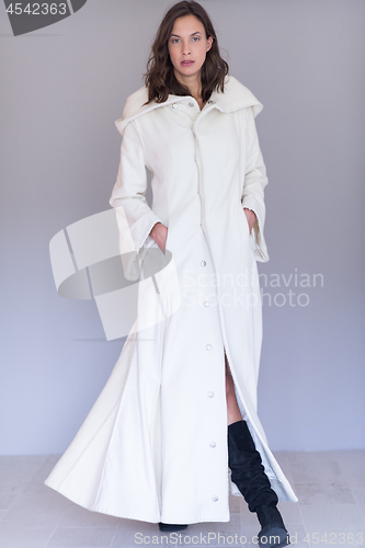 Image of woman in a white coat with hood isolated on white background