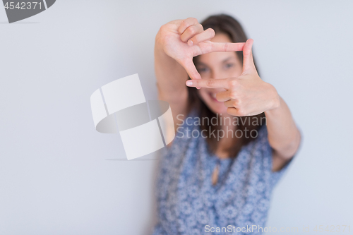 Image of woman showing framing hand gesture