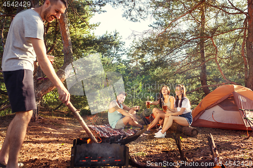 Image of Party, camping of men and women group at forest. They relaxing