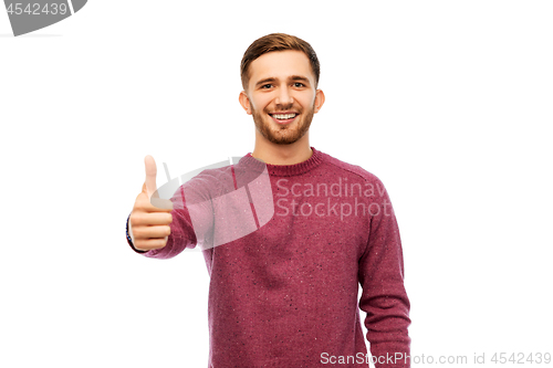 Image of happy young man showing thumbs up