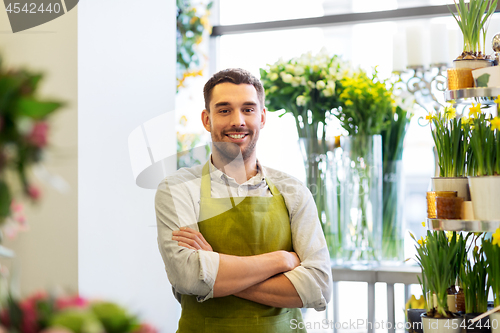 Image of florist man or seller at flower shop counter