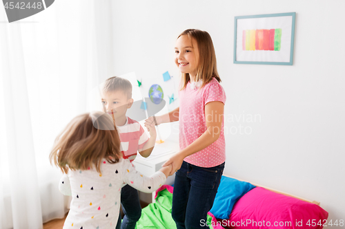 Image of happy children playing at home