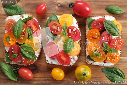 Image of Sandwiches with cheese and tomatoes.