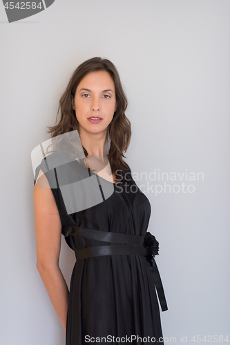 Image of woman in a black dress isolated on white background