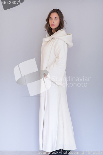 Image of woman in a white coat with hood isolated on white background