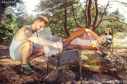 Image of Party, camping of men and women group at forest. They relaxing