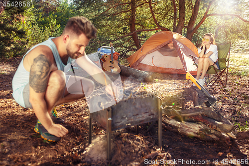 Image of Party, camping of men and women group at forest. They relaxing