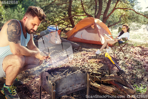 Image of Party, camping of men and women group at forest. They relaxing