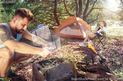 Image of Party, camping of men and women group at forest. They relaxing