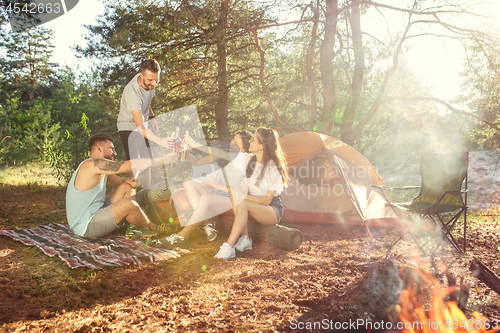 Image of Party, camping of men and women group at forest. They relaxing