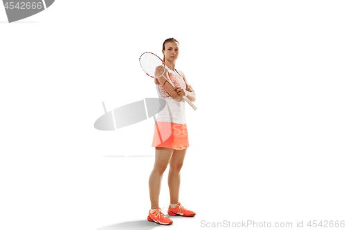 Image of Young woman badminton player standing over white background