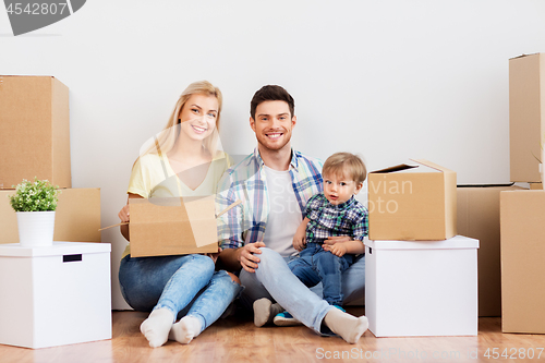 Image of happy family with boxes moving to new home