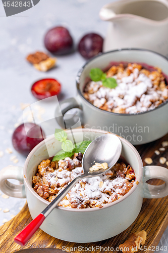 Image of Delicious crumble of red cherry plum and oatmeal.