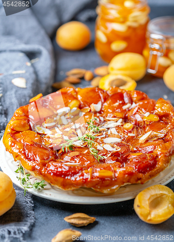 Image of Homemade tarte tatin pie with apricots and thyme.