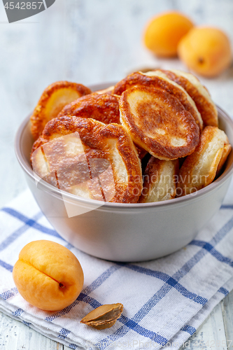 Image of Sourdough pancakes in a ceramic bowl.