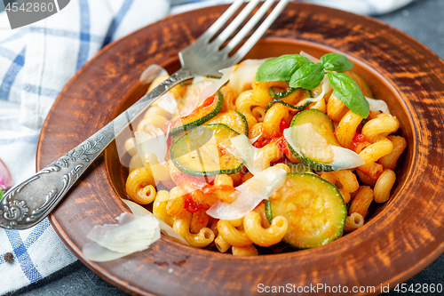 Image of Italian pasta cavatappi with zucchini and basil.