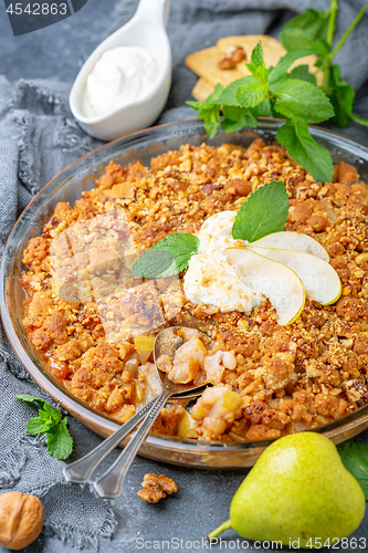 Image of Summer pear pie with crumbs and walnuts.