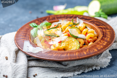 Image of Pasta with zucchini, tomatoes and Parmesan.