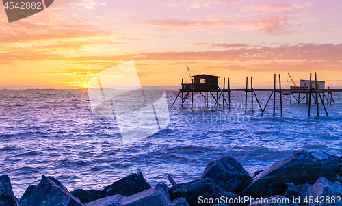 Image of Huts of fishermen in the sunset