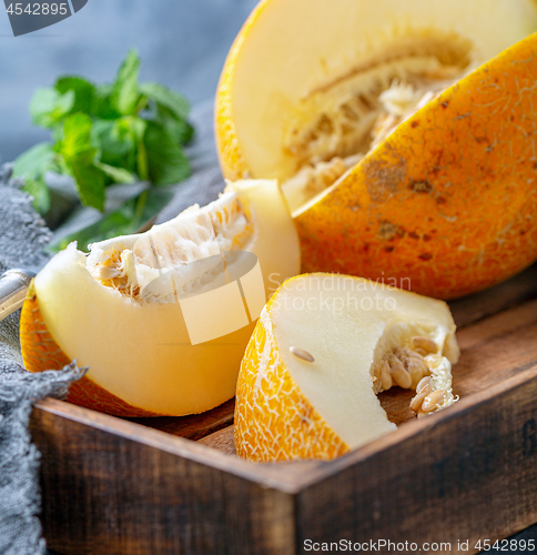 Image of Slices of ripe yellow melon close up.