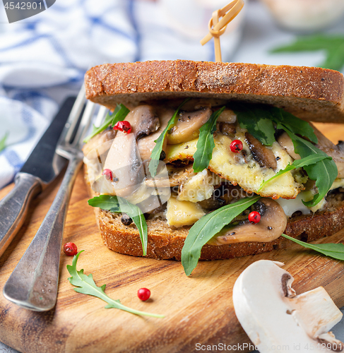 Image of Sandwich with mushrooms and scrambled eggs.