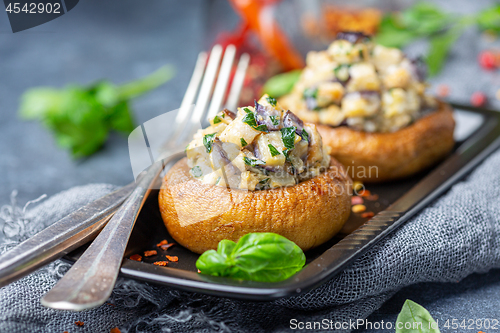 Image of Stuffed mushrooms with eggplant and herbs.