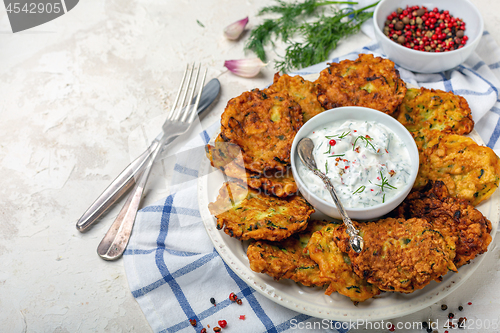 Image of Zucchini pancakes and yogurt sauce for breakfast.