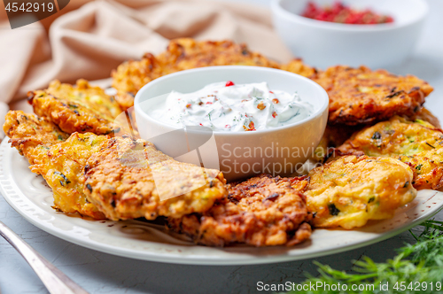 Image of Zucchini pancakes with yogurt sauce.