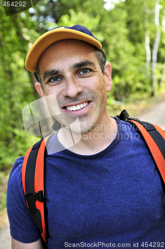 Image of Man hiking on forest trail