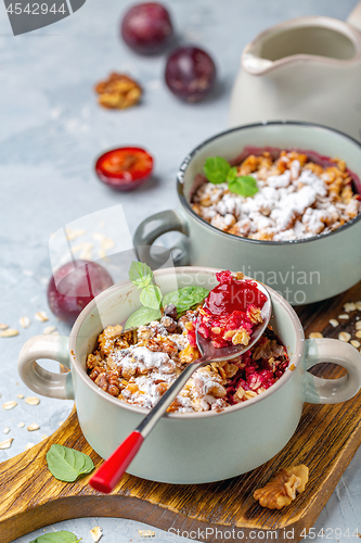 Image of Delicious crumble of red cherry plum and oatmeal.