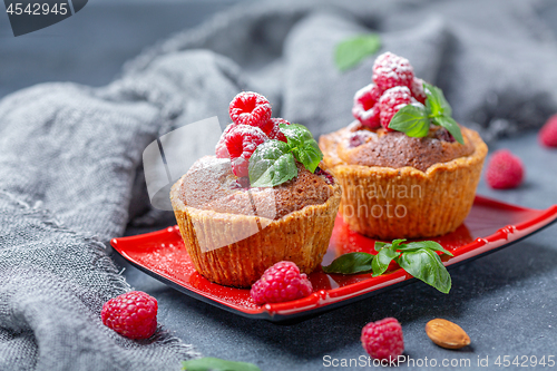 Image of Tartlets with red raspberries and frangipani.