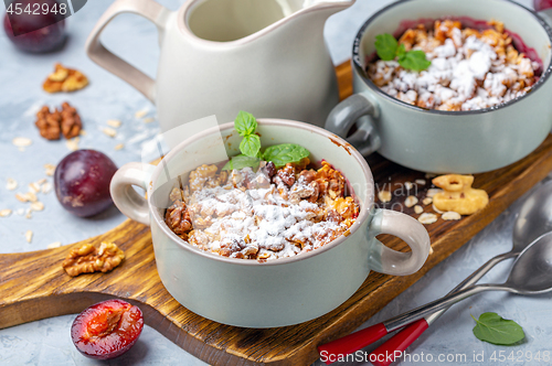 Image of Crumble of red cherry plum, oatmeal and walnut.