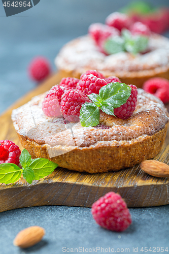 Image of Delicious mini-tarts (tartlets) with raspberries.