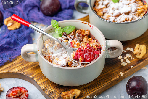 Image of Red cherry plum crumble with walnut crumb.