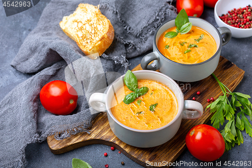 Image of Tomato soup with cream and basil.