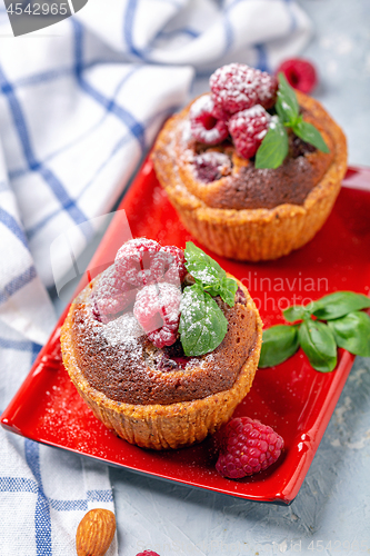 Image of Mini tarts with raspberry, frangipani and mint.