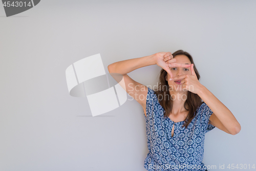 Image of woman showing framing hand gesture