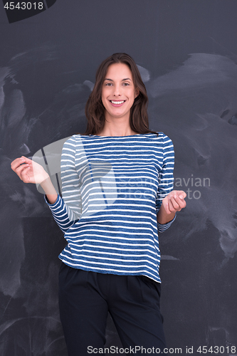 Image of woman standing in front of chalk drawing board