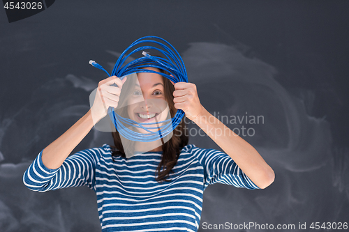 Image of woman holding a internet cable in front of chalk drawing board