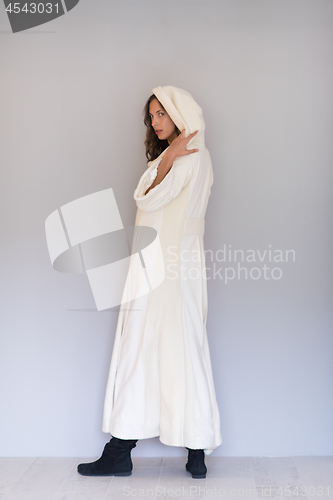 Image of woman in a white coat with hood isolated on white background