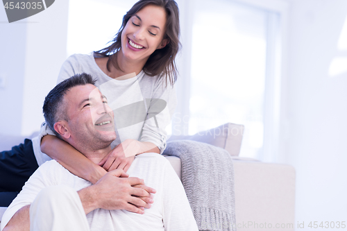 Image of couple hugging in their new home