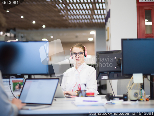 Image of businesswoman using a laptop in startup office