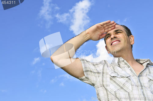 Image of Happy man looking into distance