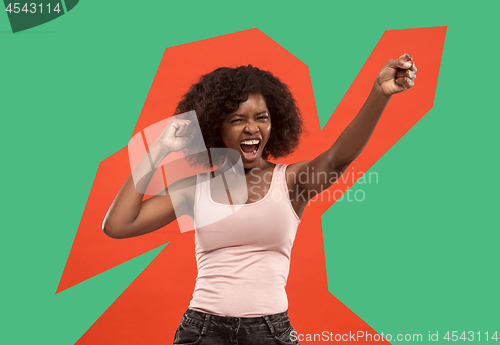 Image of Winning success woman happy ecstatic celebrating being a winner. Dynamic energetic image of female afro model