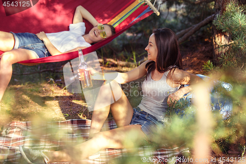 Image of Party, camping of men and women group at forest. They relaxing and eating barbecue