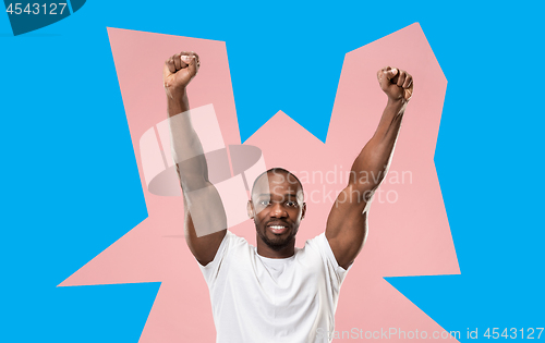 Image of Winning success man happy ecstatic celebrating being a winner. Dynamic energetic image of male model