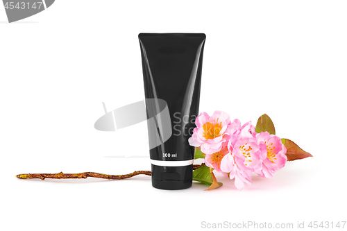 Image of a black tube with cherry blossoms on a white background