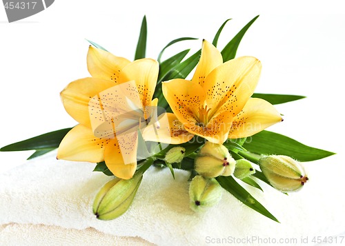 Image of Stack of towels with flowers