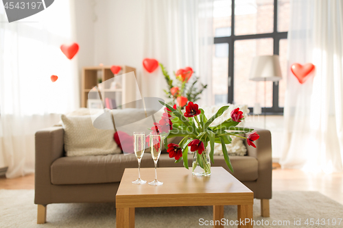 Image of champagne glasses and flowers on valentines day