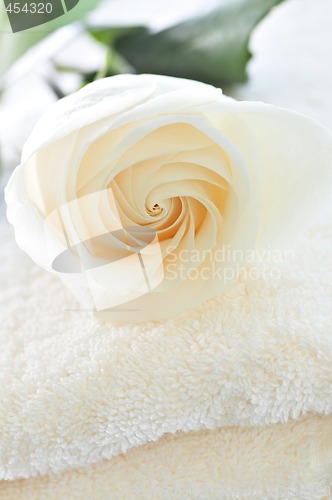 Image of Stack of towels and rose